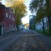 Quiet street with old buildings and trees in autumn